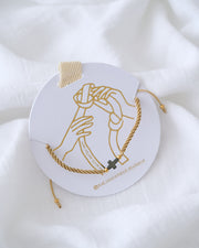 PULSERA CRUZ HEMATITA CON HILO DOBLE