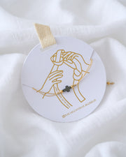 PULSERA CRUZ HEMATITA CON HILO SENCILLO