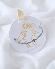 PULSERA CRUZ HEMATITA CON HILO DOBLE