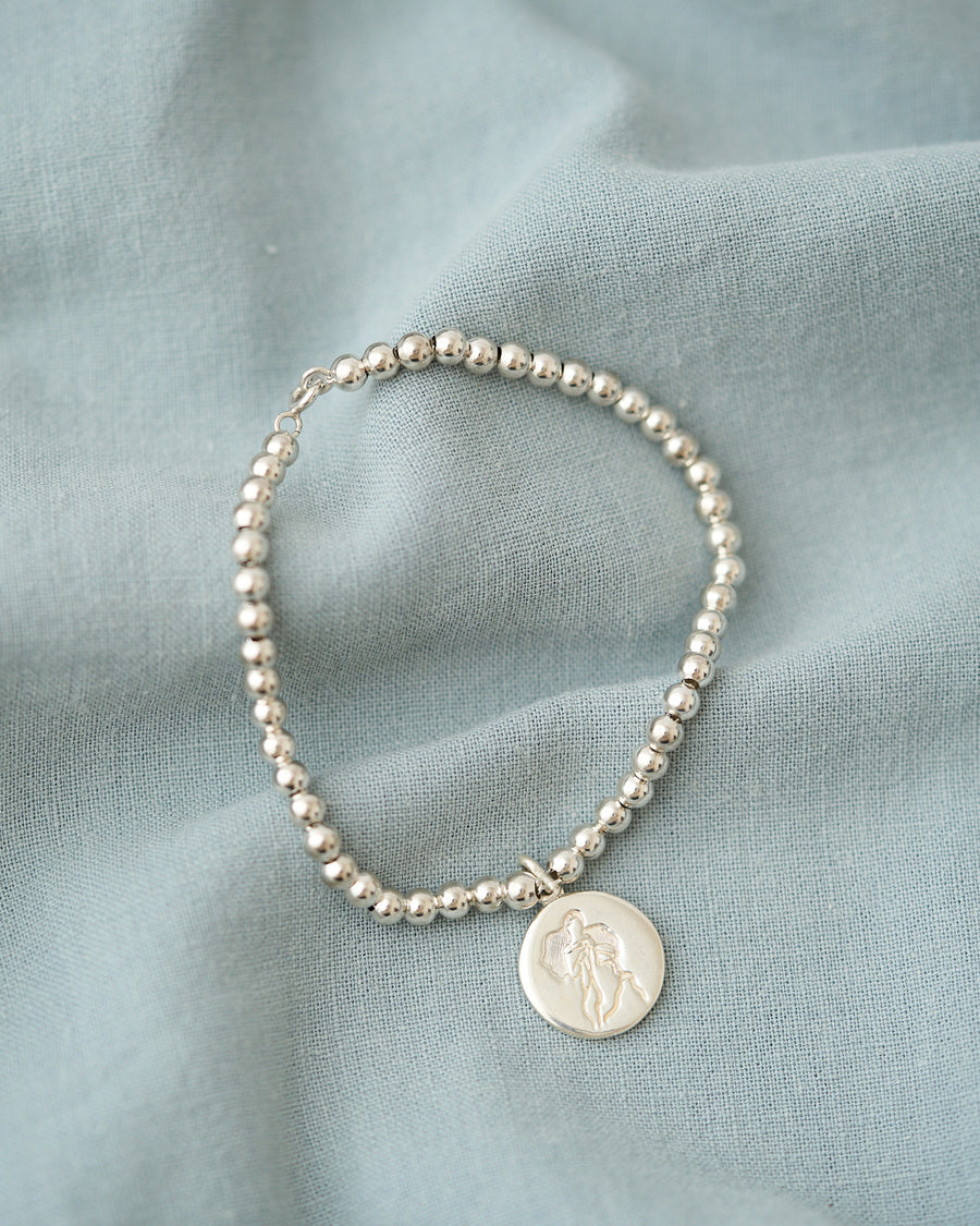 PULSERA ESFERAS CON MEDALLA DESATADORA PLATA .925