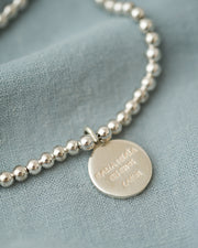 PULSERA ESFERAS CON MEDALLA DESATADORA PLATA .925